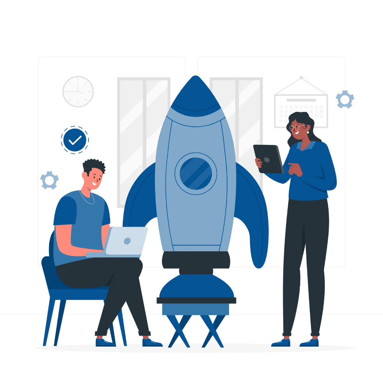 A men and a women with a laptop next to a rocket model.